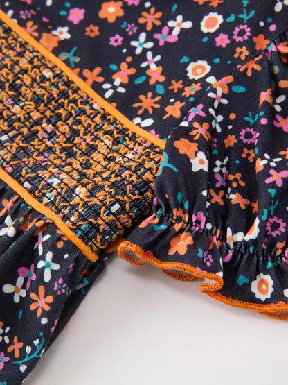 Baby Girls Fall Floral Smocked Bubble Romper | Orange Bow Puff Sleeve