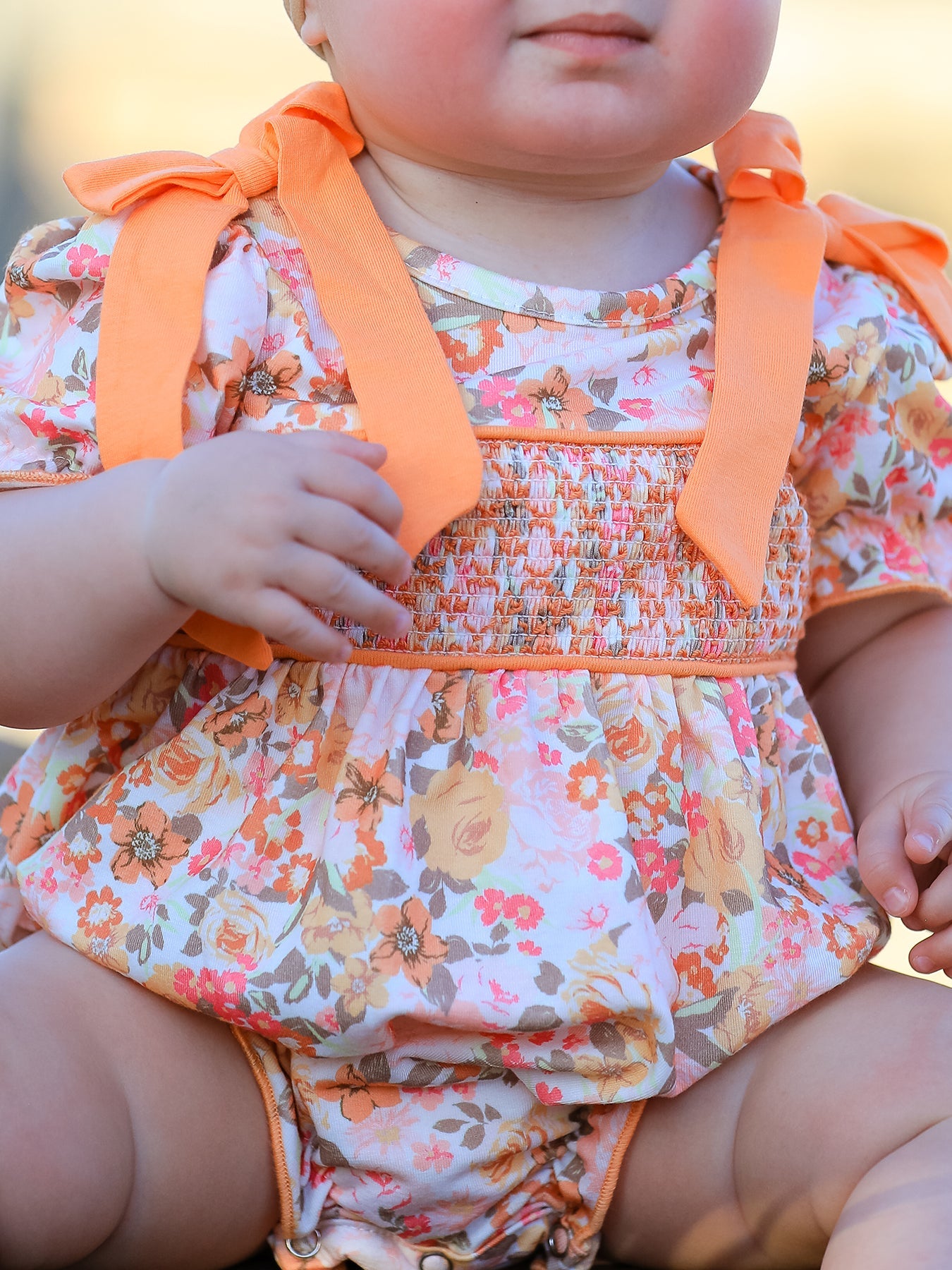 Baby Girls Peach Floral Smocked Bubble Romper | Bow Shoulder Puff Sleeve