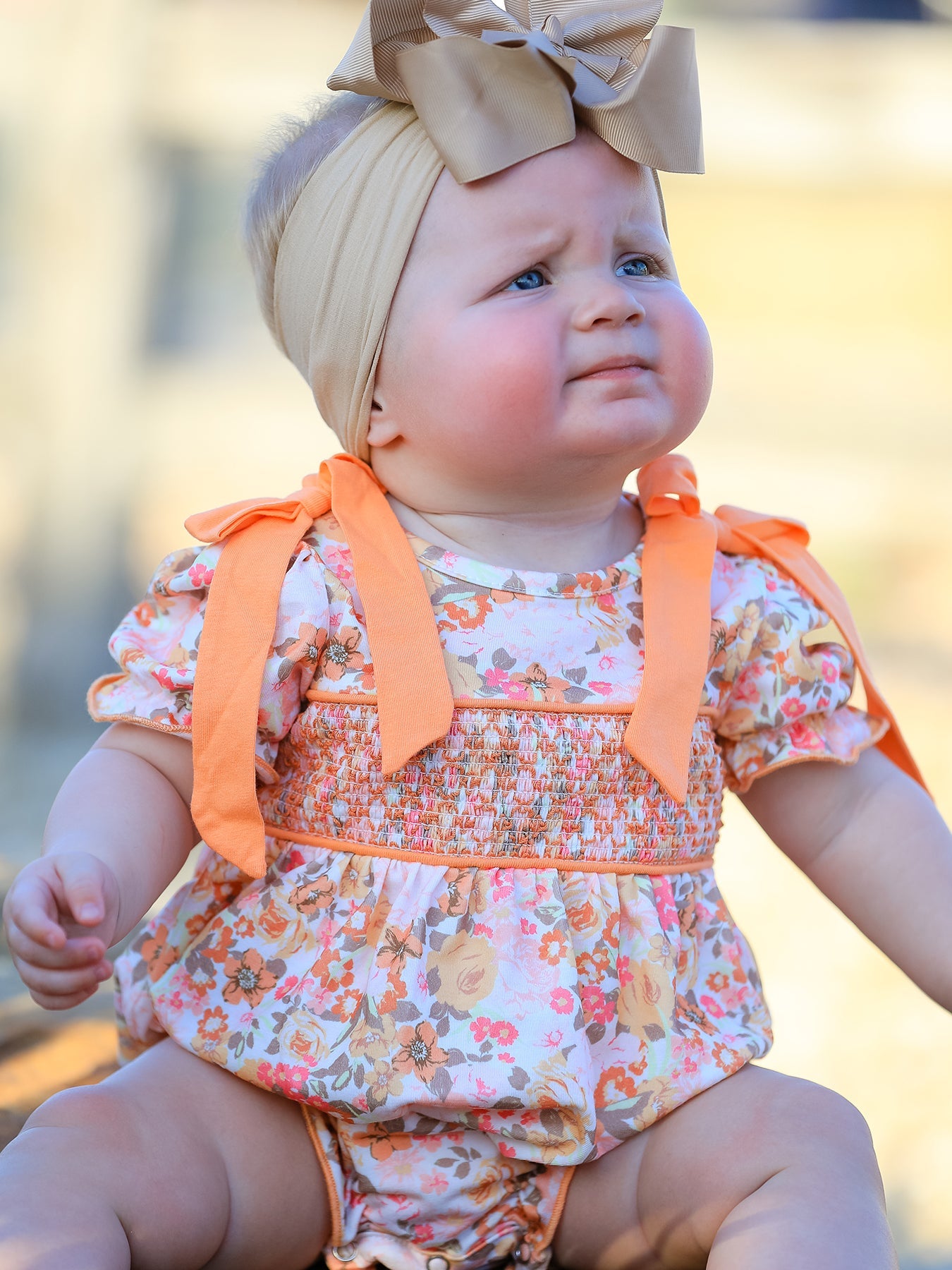 Baby Girls Peach Floral Smocked Bubble Romper | Bow Shoulder Puff Sleeve