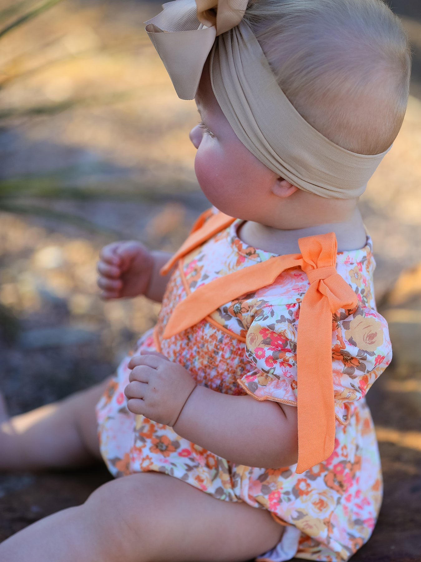 Baby Girls Peach Floral Smocked Bubble Romper | Bow Shoulder Puff Sleeve