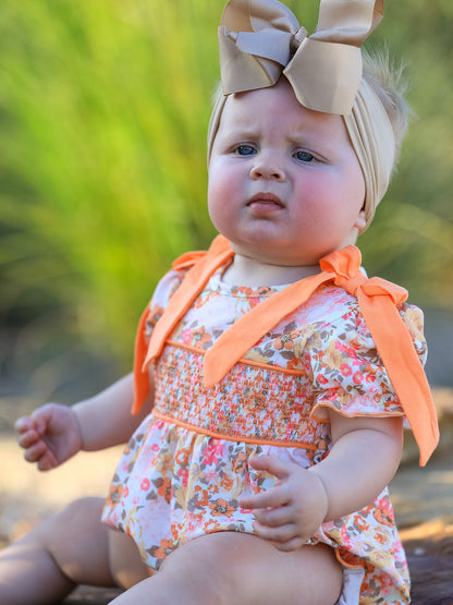 Baby Girls Peach Floral Smocked Bubble Romper | Bow Shoulder Puff Sleeve