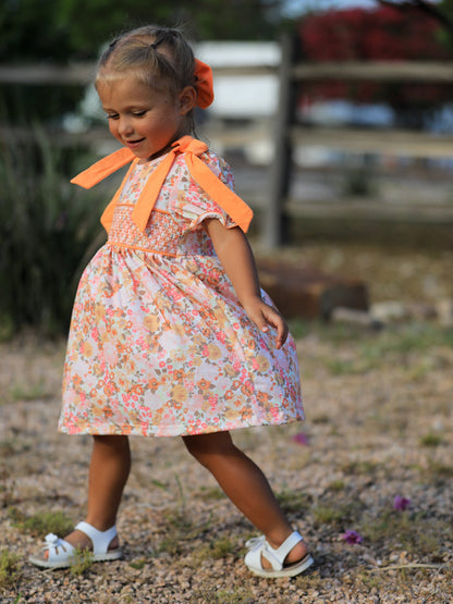 Girls Peach Floral Smocked Dress | Bow Shoulder Puff Sleeve Boutique